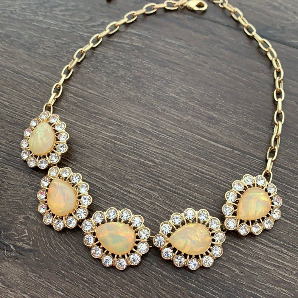 Gold tone statement necklace with opalescent acrylic stones and clear stones